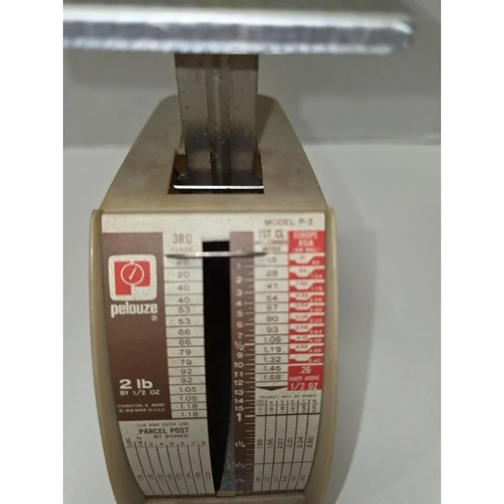 vintage Pelouze Model P-2 postal scale designed to weigh parcels up to 2 pounds.